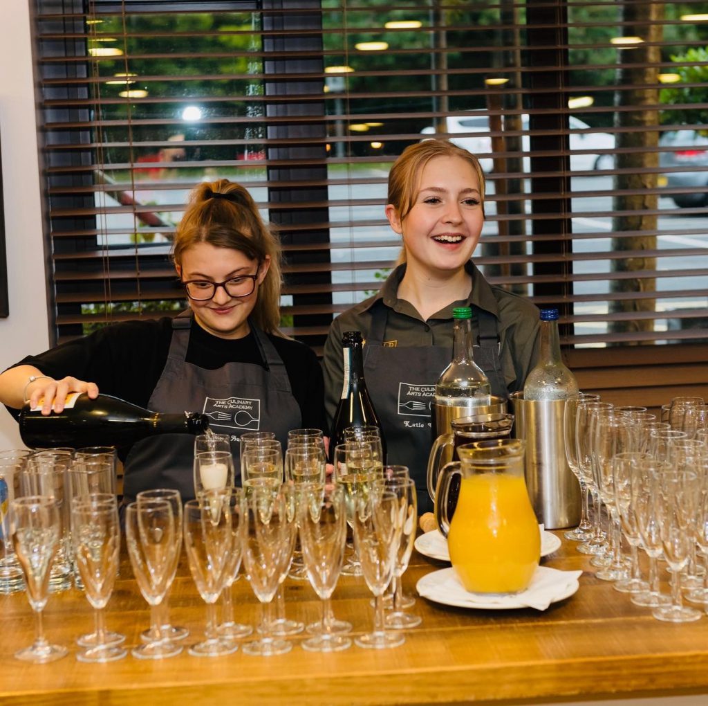 Students serving guests in Edmunds Restaurant