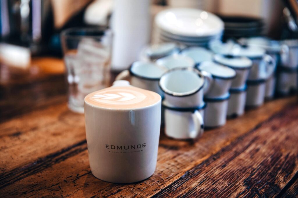 An Edmunds branded coffee cup